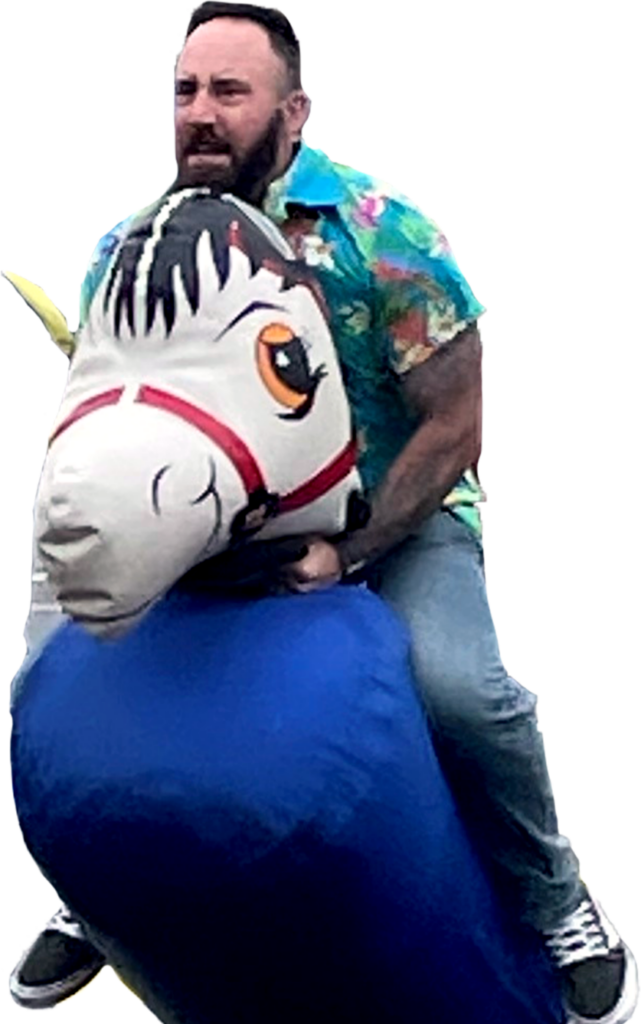 Jon Duffty riding an inflatable horse